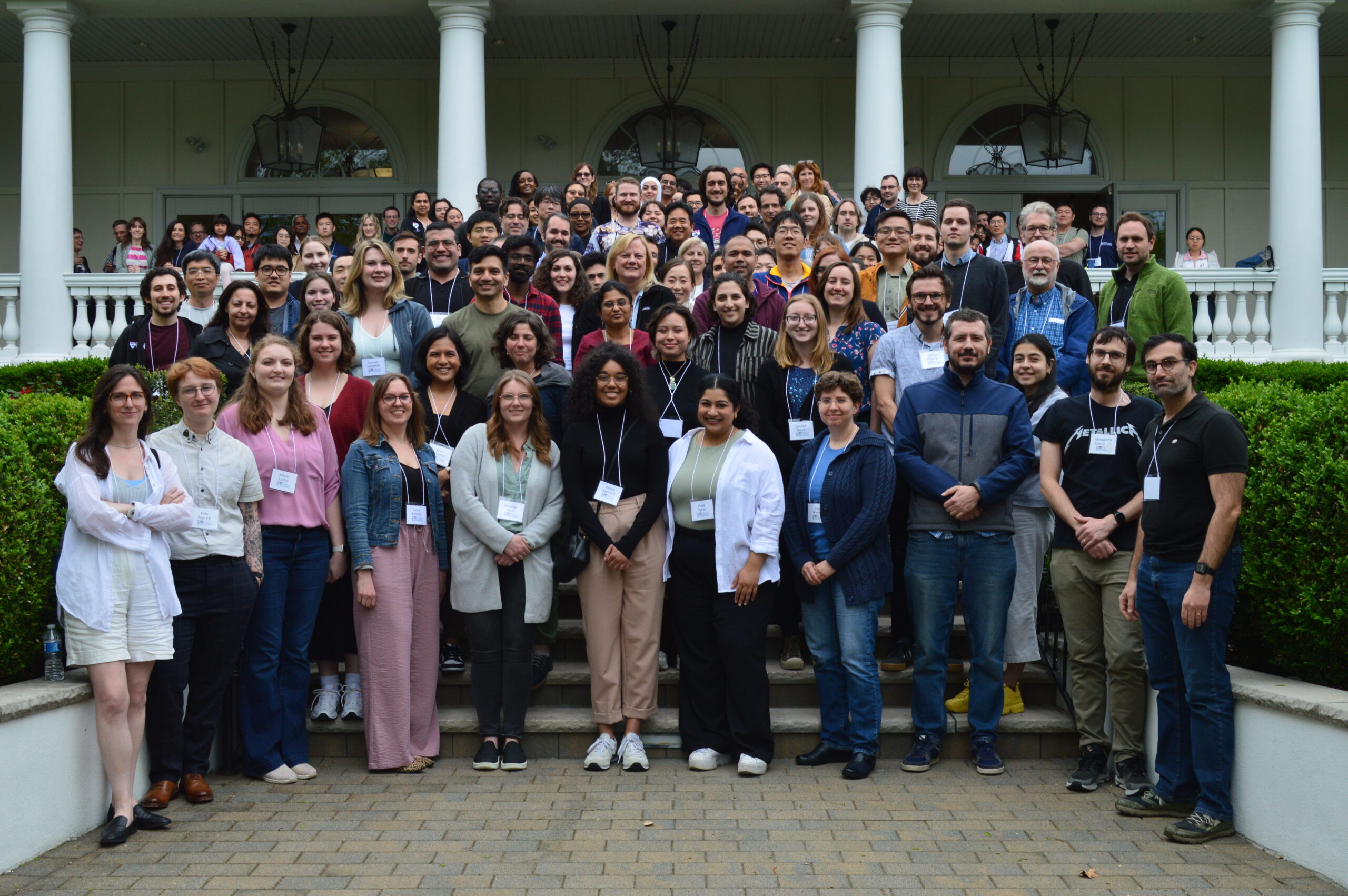 Group picture of the entire Department of Cell and Developmental Biology. All participants are standing and smiling together on the steps of a building